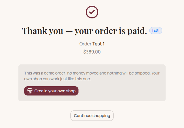 The thank-you page after a test order on the demo shop: "Thank you — your order is paid" with a TEST badge, the order number and the amount